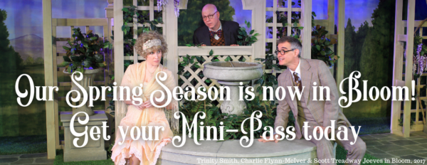 The Text "Our Spring Season is now in Bloom. get Your Mini-Pass today" overlaid an image of a woman in a light pink flowing dress sitting on a fountain and two men in suits looking at her with silly faces. It is a photo from the 2017 production of Jeeves in Bloom.